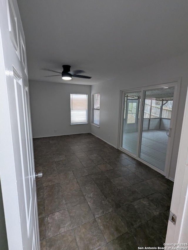 unfurnished room featuring ceiling fan