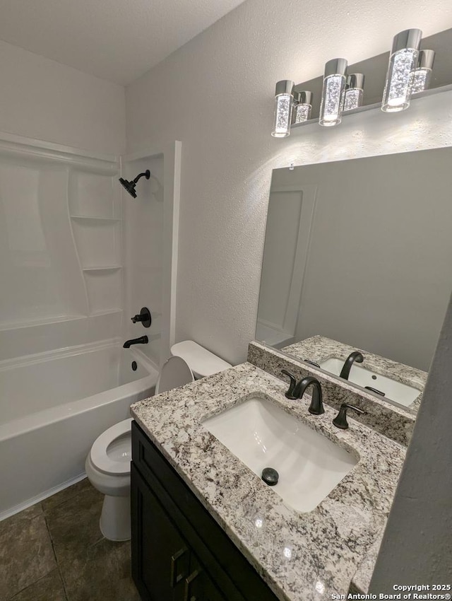 full bathroom featuring tile patterned floors, vanity, toilet, and shower / bathing tub combination