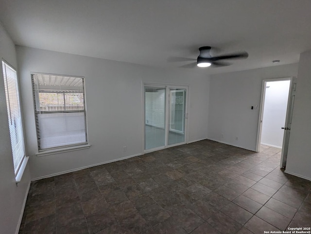 unfurnished room with ceiling fan