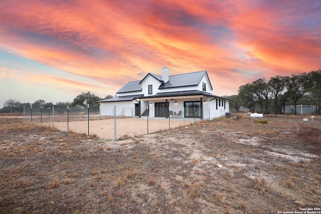 view of property exterior at dusk