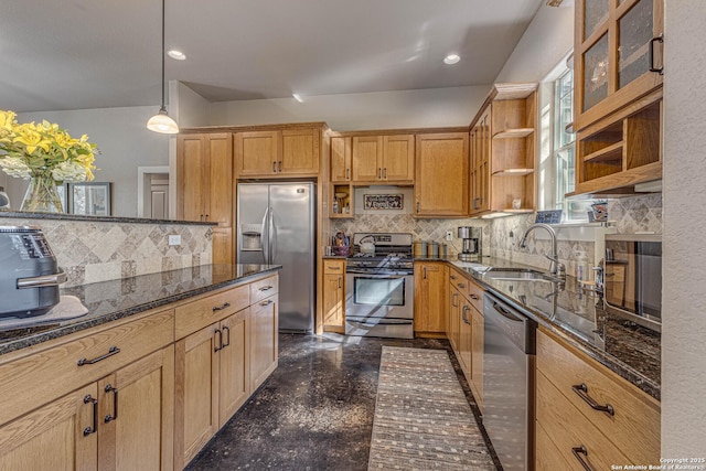 kitchen with sink, hanging light fixtures, stainless steel appliances, decorative backsplash, and dark stone counters