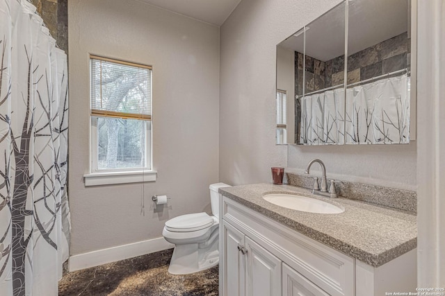 bathroom featuring vanity, toilet, and a shower with shower curtain