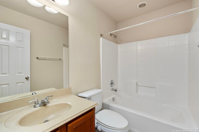 full bathroom with vanity, toilet, and  shower combination