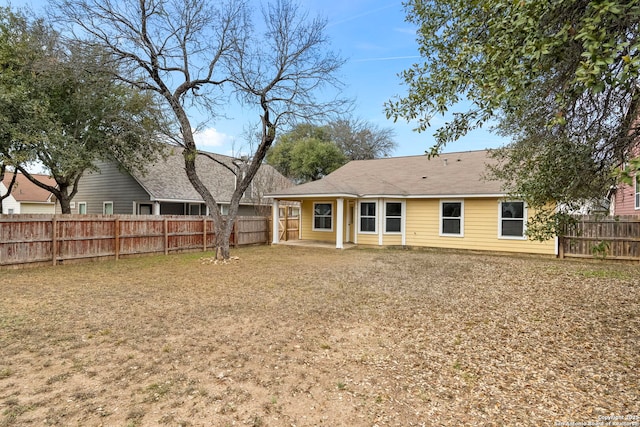 rear view of property featuring a patio area