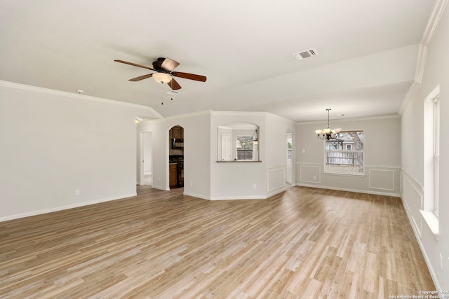 unfurnished living room with ceiling fan with notable chandelier, ornamental molding, and light hardwood / wood-style floors