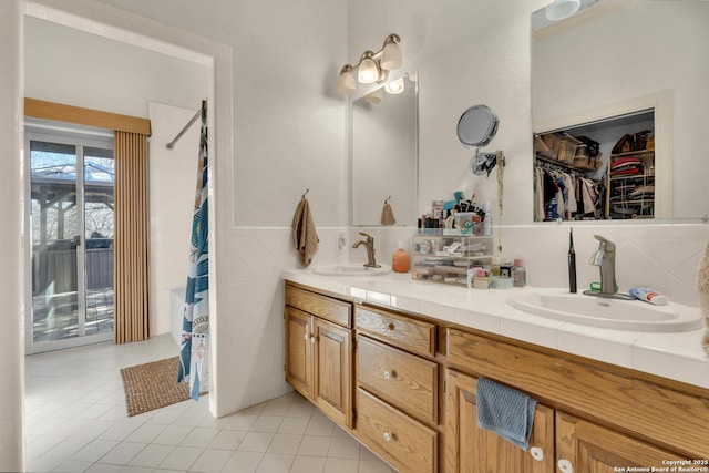 bathroom featuring vanity, tile walls, and tile patterned floors