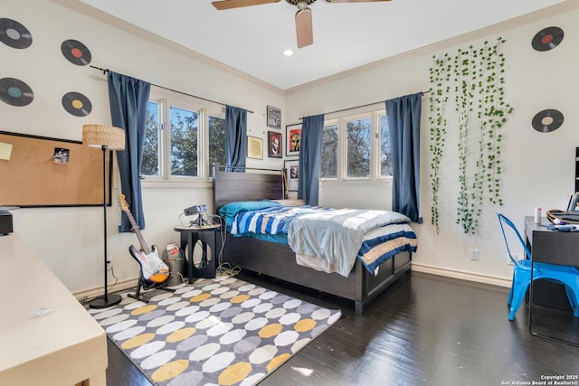 bedroom featuring crown molding, ceiling fan, and dark wood-type flooring