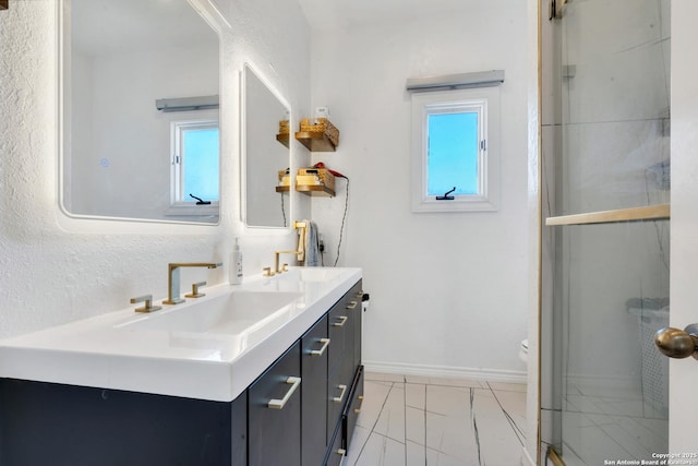 bathroom featuring vanity, a wealth of natural light, an enclosed shower, and toilet