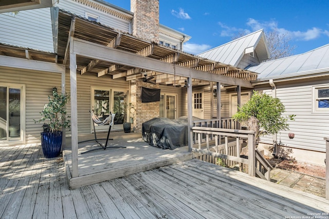 wooden terrace featuring a pergola and grilling area