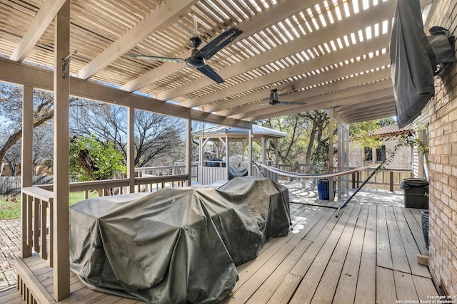 wooden terrace featuring a pergola and ceiling fan