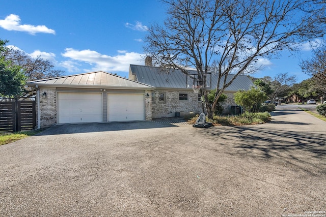 view of side of property with a garage