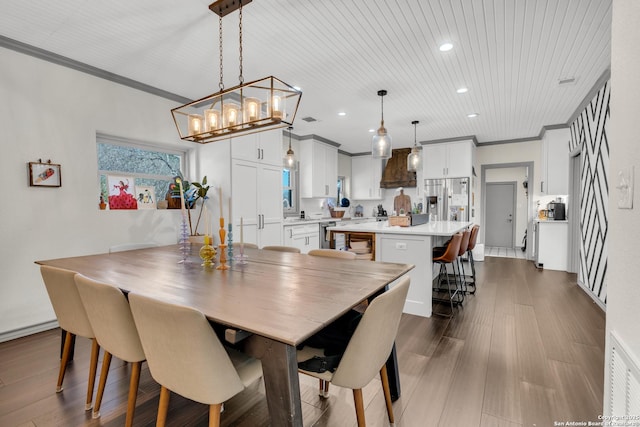 dining room featuring crown molding, wooden ceiling, and dark hardwood / wood-style floors