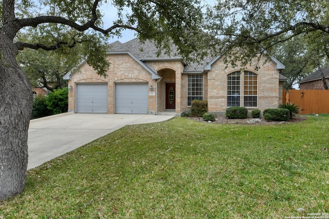 single story home with a garage and a front yard