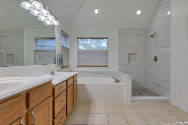 bathroom with vanity, vaulted ceiling, tile patterned floors, and separate shower and tub