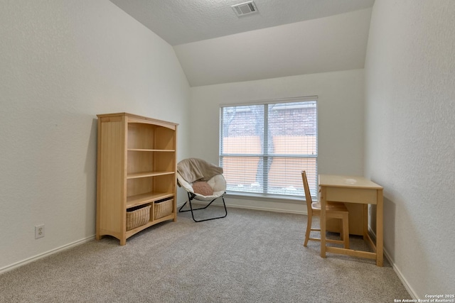 living area with carpet floors and vaulted ceiling