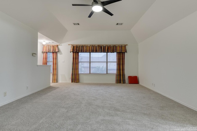 unfurnished living room featuring ceiling fan, lofted ceiling, and carpet flooring