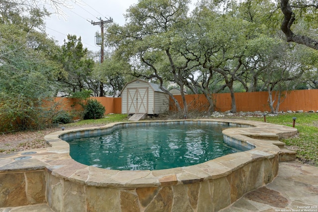 view of pool with a shed