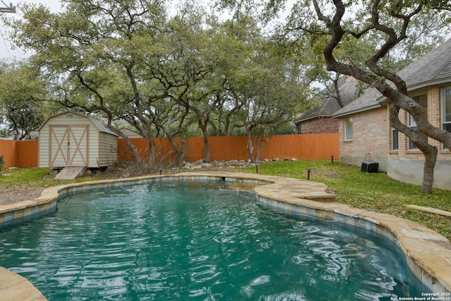 view of swimming pool with a storage shed