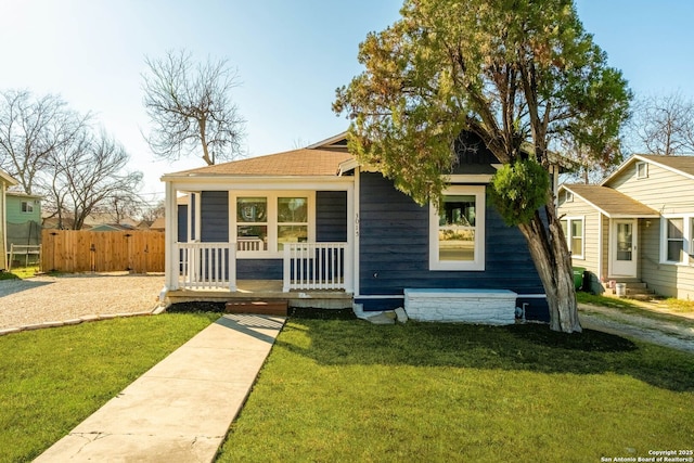 bungalow featuring a front lawn and a porch