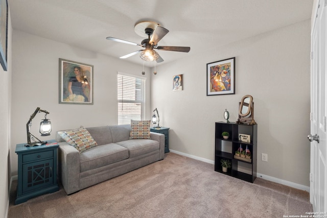 carpeted living room with ceiling fan