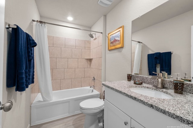 full bathroom featuring vanity, toilet, shower / tub combo, and wood-type flooring