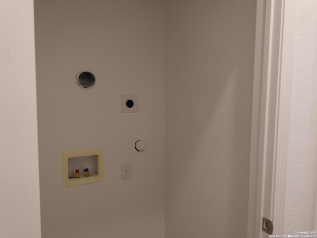 clothes washing area featuring hookup for a gas dryer, hookup for a washing machine, and hookup for an electric dryer