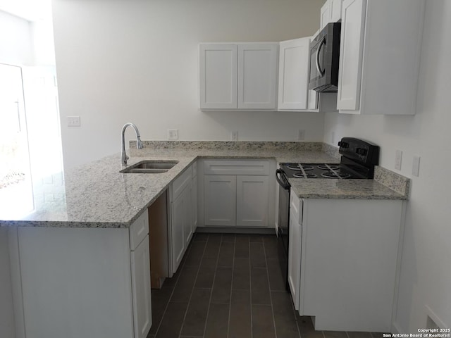 kitchen featuring sink, kitchen peninsula, black range with electric cooktop, light stone countertops, and white cabinets