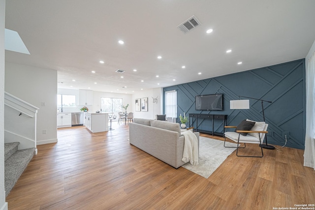 living room with light hardwood / wood-style floors