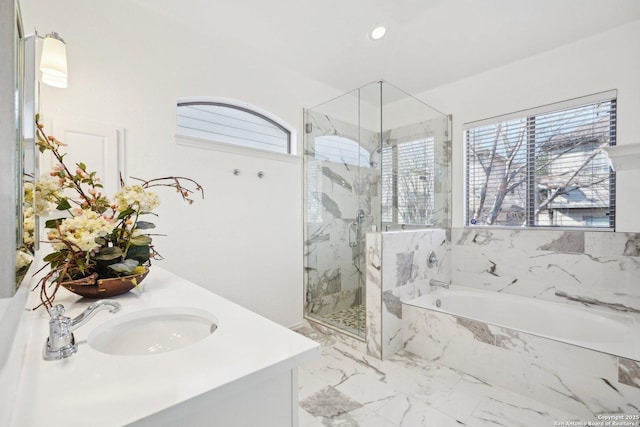 bathroom featuring vanity and separate shower and tub