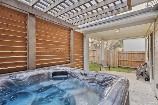 view of patio with a pergola and an indoor hot tub