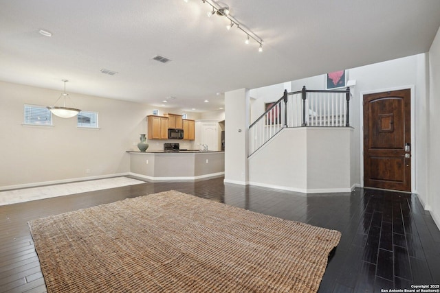 unfurnished dining area with dark hardwood / wood-style floors