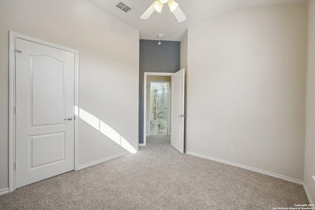 unfurnished bedroom with ceiling fan, light colored carpet, and lofted ceiling