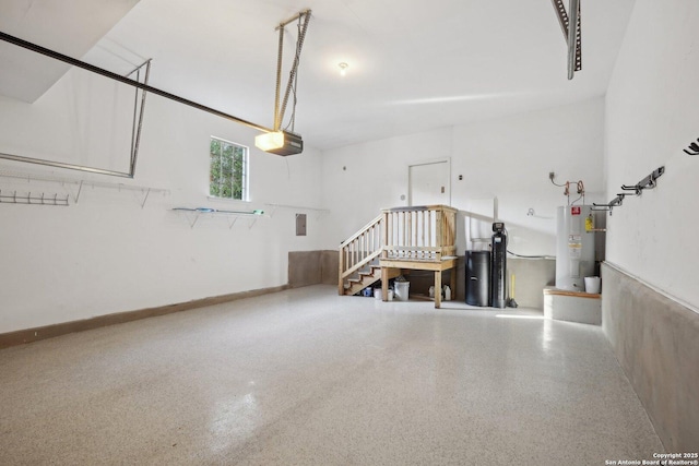 garage featuring a garage door opener and gas water heater