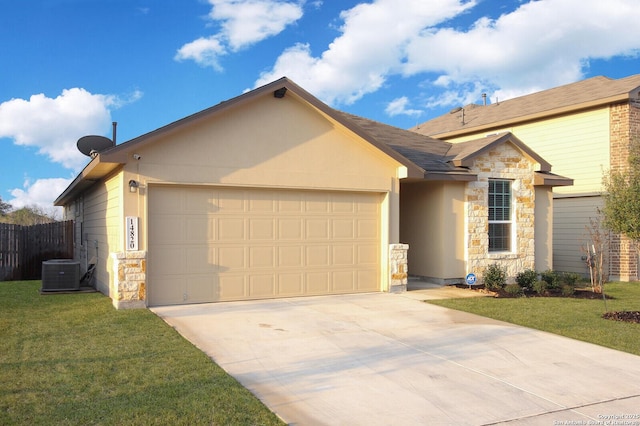 ranch-style home with a garage, central AC, and a front yard