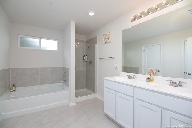 bathroom featuring tile patterned flooring, vanity, and independent shower and bath