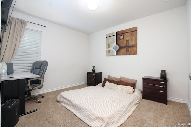 bedroom with light colored carpet