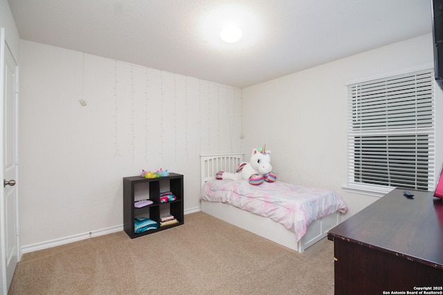 bedroom featuring light colored carpet