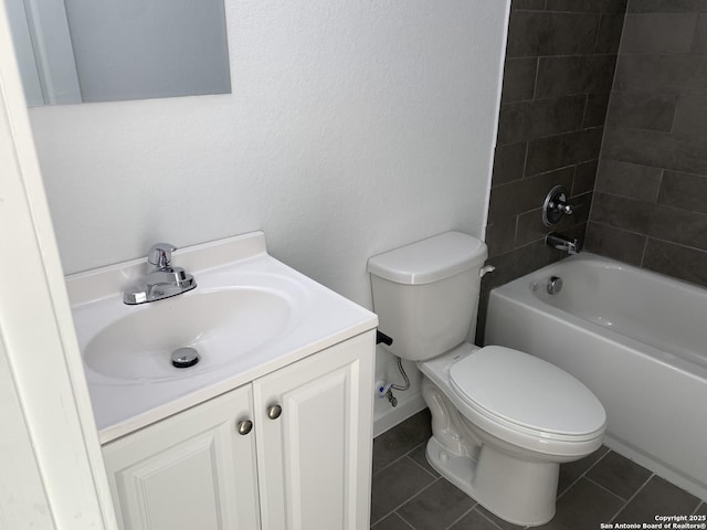 full bathroom with tiled shower / bath combo, vanity, tile patterned floors, and toilet