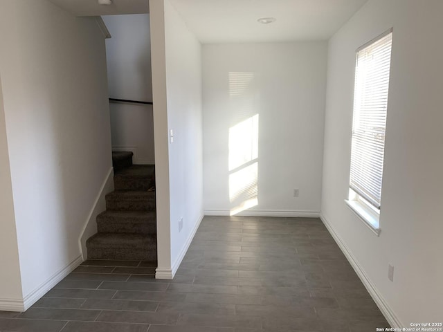 stairway featuring wood-type flooring