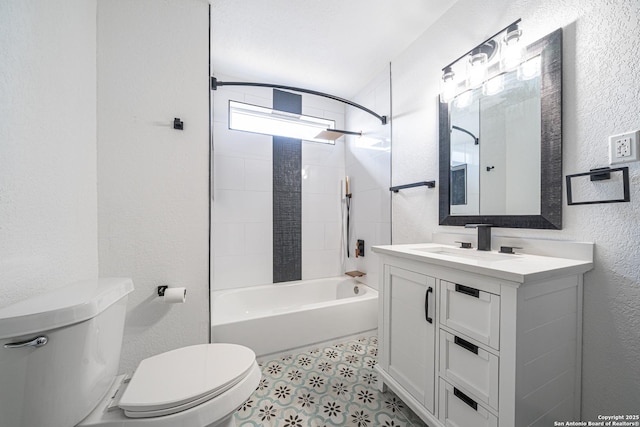 full bathroom with vanity, tiled shower / bath, and toilet