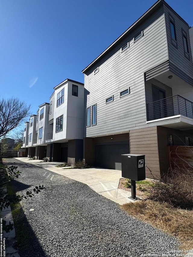 view of property exterior with a garage