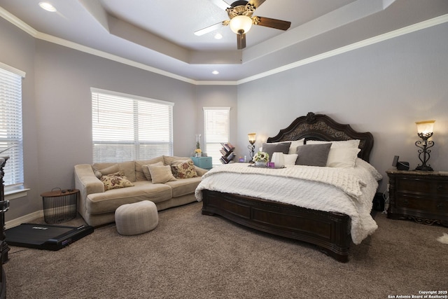 bedroom with crown molding, a raised ceiling, ceiling fan, and carpet flooring