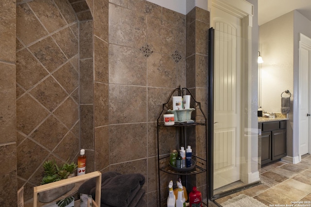 bathroom featuring vanity and ornate columns