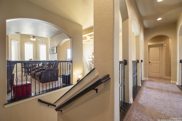 hallway featuring carpet flooring