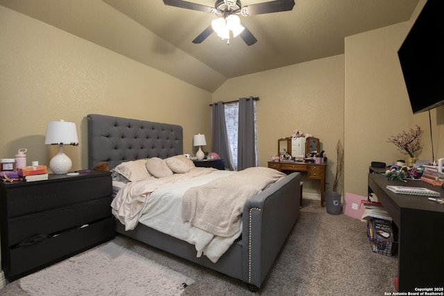 carpeted bedroom with ceiling fan and lofted ceiling