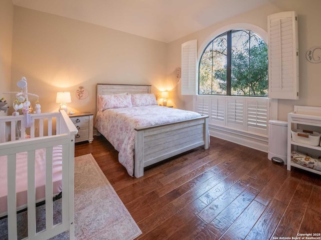 bedroom featuring dark hardwood / wood-style floors