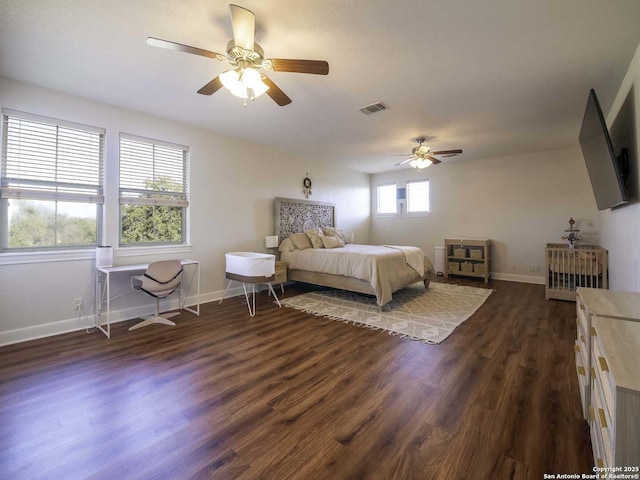 bedroom featuring dark hardwood / wood-style flooring and ceiling fan