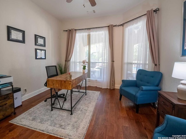 office space featuring ceiling fan and dark hardwood / wood-style floors