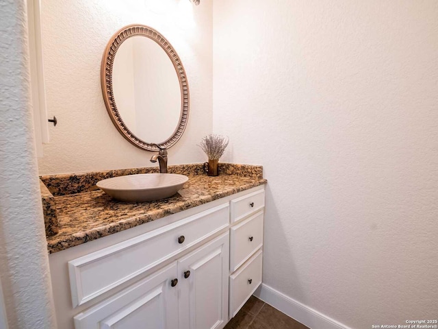 bathroom with tile patterned floors and vanity