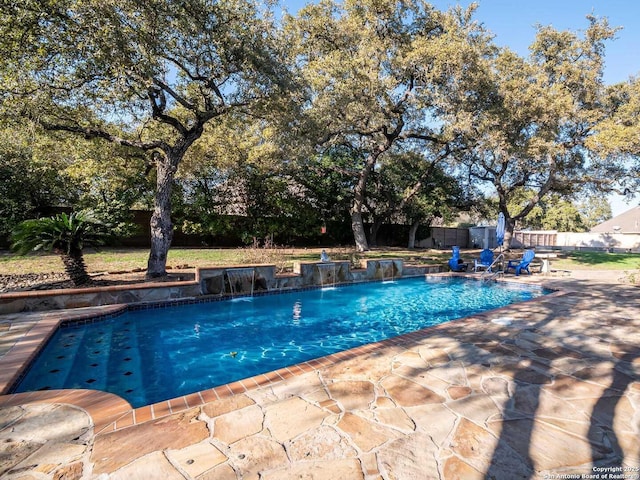 view of pool featuring a patio and pool water feature